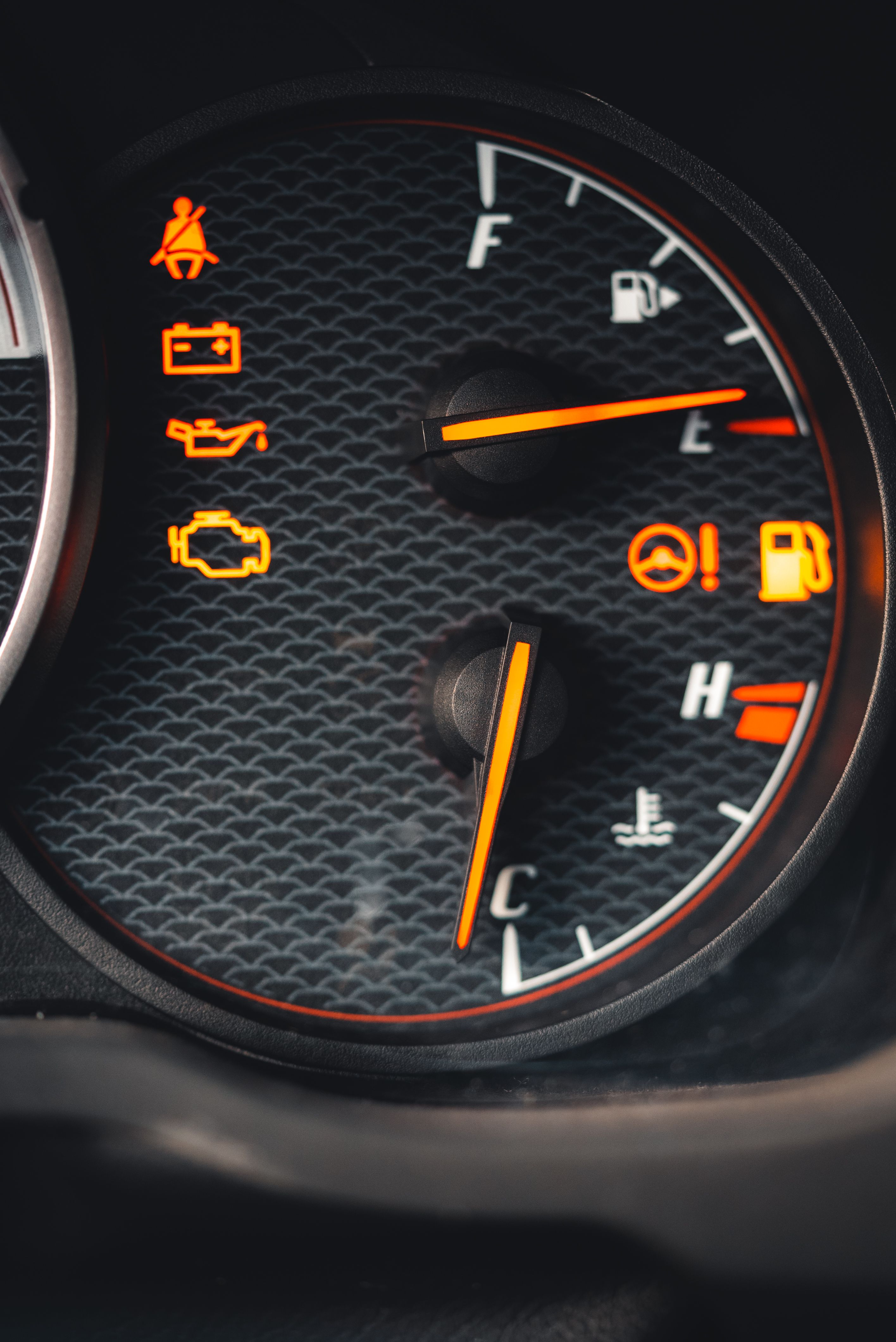 Close-up of a truck dashboard with multiple warning lights illuminated